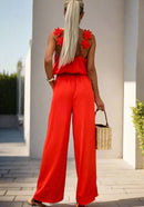 Leona – Ärmelloser Jumpsuit mit weitem Bein rückenfreier Passform und verstellbaren Trägern