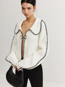 Delia – Strickjacke mit übergroßen Ärmeln und Kontrastnähten