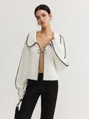 Delia – Strickjacke mit übergroßen Ärmeln und Kontrastnähten