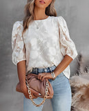 Rhea – Elegante Blumenbluse mit V-Ausschnitt und Puffärmeln