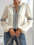 Mira – Lässige Bluse mit tiefem V-Ausschnitt und Puffärmeln