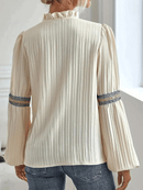 Mira – Lässige Bluse mit tiefem V-Ausschnitt und Puffärmeln