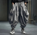 Kian – Weite drapierte Hose mit umgeschlagenem Saum und lockerer Passform