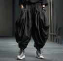 Kian – Weite drapierte Hose mit umgeschlagenem Saum und lockerer Passform