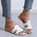 Nora – Trendy flache Slide-Sandalen mit breiter Riemenanordnung und offenem Zehendesign
