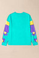 Maya – Modernes Langarmshirt mit floralen Akzenten und Blockdesign