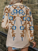 Isola – Elegantes Button-Up-Shirt mit Blumenmuster und Puffärmeln