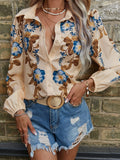Isola – Elegantes Button-Up-Shirt mit Blumenmuster und Puffärmeln