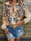 Isola – Elegantes Button-Up-Shirt mit Blumenmuster und Puffärmeln
