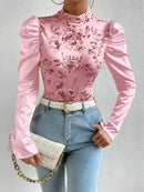 Amara – Blumenbluse mit hohem Ausschnitt und Puffärmeln